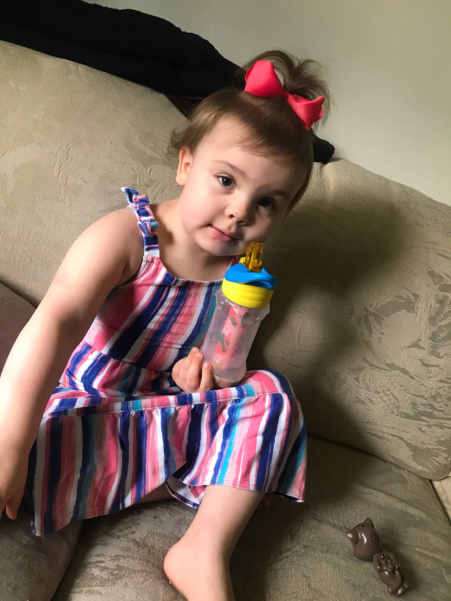 Addie is registered to the contest to win money with this photo: child, finger, leg, person, pigtail, sitting, thigh