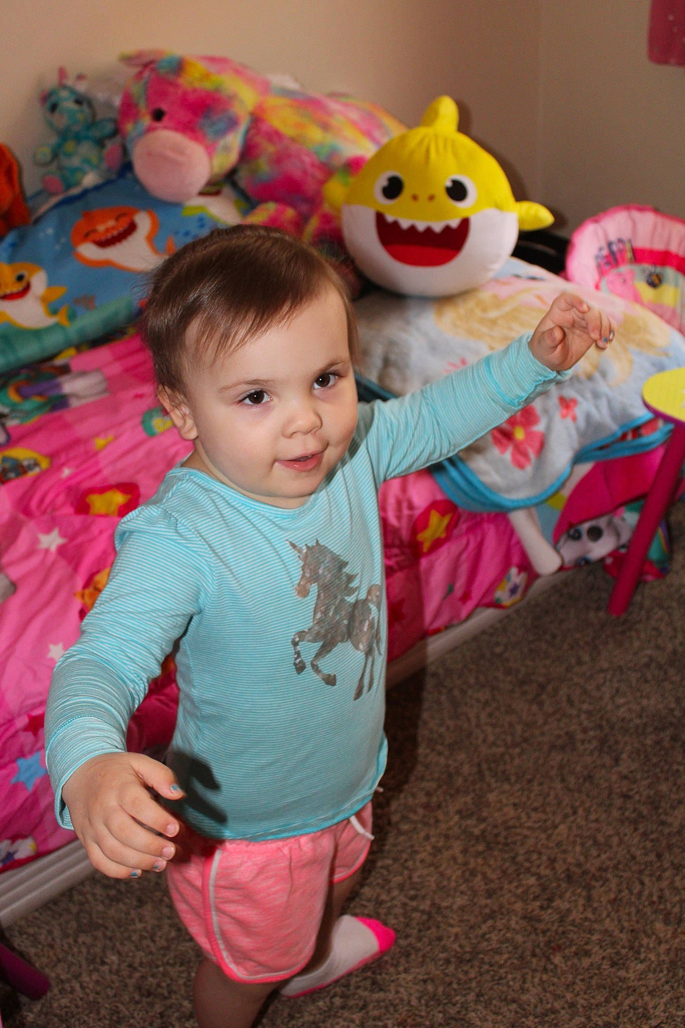 Addie is registered to the contest to win money with this photo: baby, child, fun, happy, head, person, pink, play, room, skin, smile, stuffed_toy, toddler