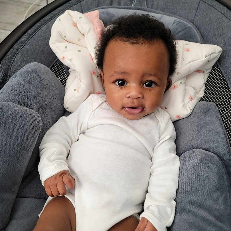 Aleiah is registered to the contest to win money with this photo: baby, babylaughing, blackhair, blanket, clothing, crib, cushion, face, furniture, hair, happy, head, homedecor, infantbed, person, photography, portrait, sitting, sleeve, smile