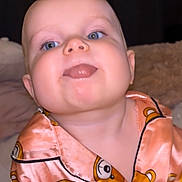 Violet-Rose joined the competition — help win amazing prizes! baby, child, blue_eyes, tongue_out, pajamas, pink_clothing, teddy_bear_pattern, close_up, cute, infant, face, happy, indoors, soft_lighting, person, young_child, smiling, sleepwear, funny_expression, portrait
