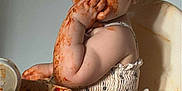 Violet-Rose is registered to the contest to win money with this photo: toddler, baby, high_chair, messy, food, spaghetti_sauce, eating, child, face, hand, clothing, plate, meal_time, kitchen, food_stains, mess, curious, innocent, sitting, indoor