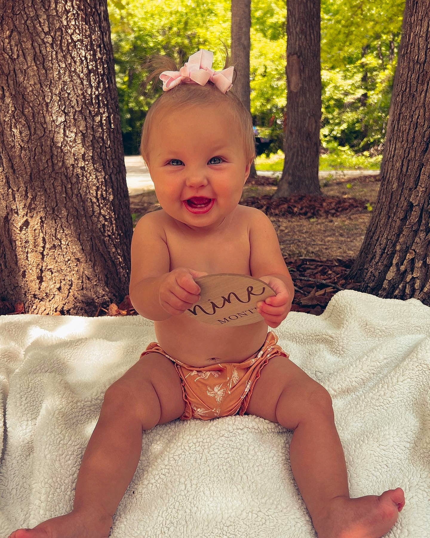 Trinady is registered to the contest to win money with this photo: baby, baby_toddler_clothing, chest, eye, face, finger, fun, grass, happy, head, people_in_nature, person, pink, shorts, skin, smile, stomach, summer, toddler, tree