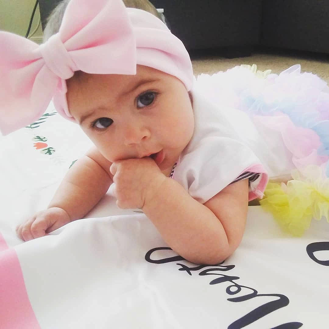 Kaci joined the competition — help win amazing prizes! baby, baby_toddler_clothing, beauty, cheek, child, costume, ear, eye, face, forehead, hair_accessory, hand, happy, head, headgear, headwear, person, pink, product, skin