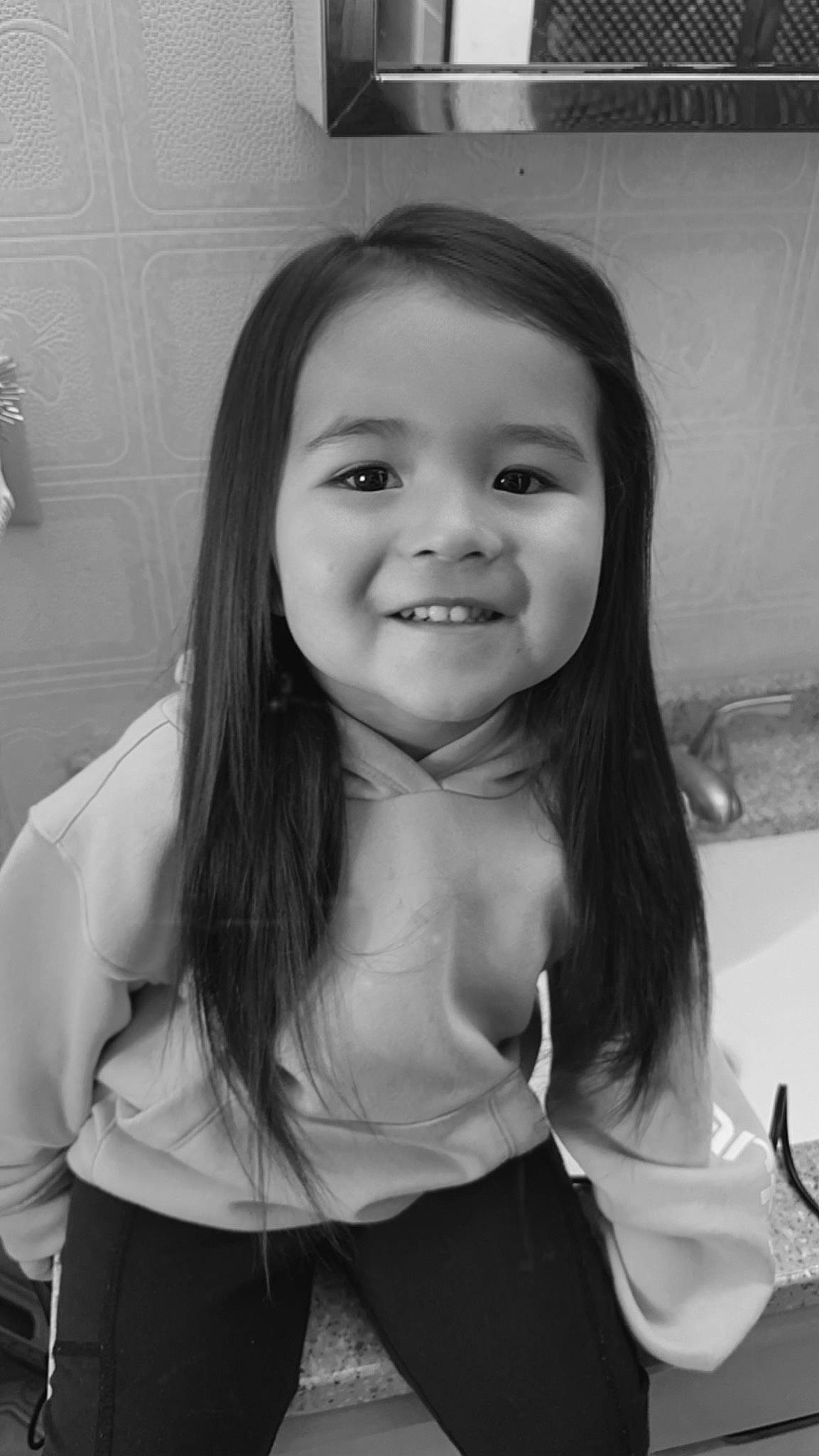 Malaya joined the competition — help win amazing prizes! black_and_white, black_hair, child, eye, eyelash, flash_photography, fun, gesture, hair, happy, head, iris, joy, long_hair, monochrome, monochrome_photography, person, shoulder, smile, standing