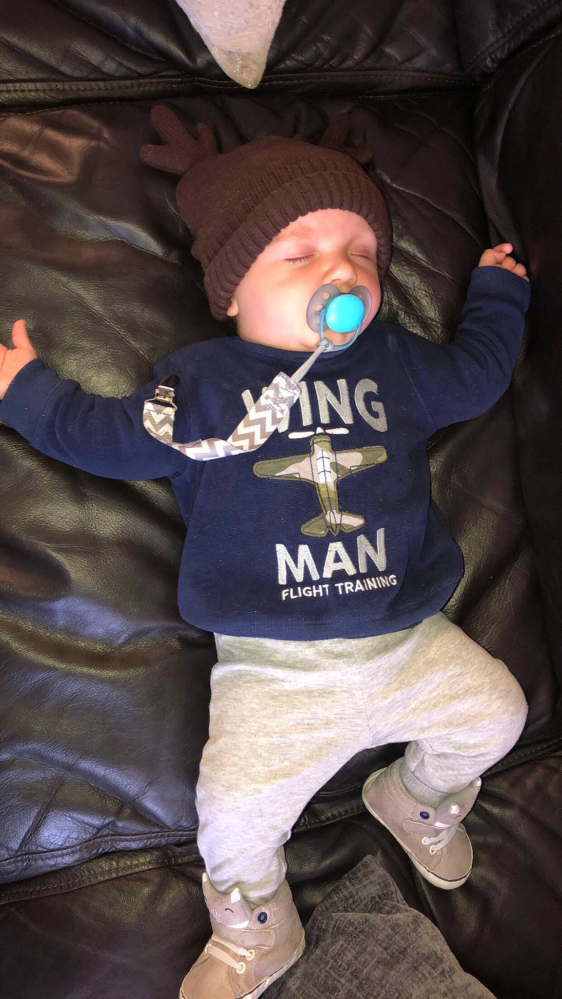 Tj Allan is registered to the contest to win money with this photo: baby, baby_toddler_clothing, baseball_cap, beanie, cap, cheek, child, electric_blue, fun, headwear, hood, hoodie, outerwear, person, personal_protective_equipment, sitting, sleeve, sports_gear, sportswear, t_shirt