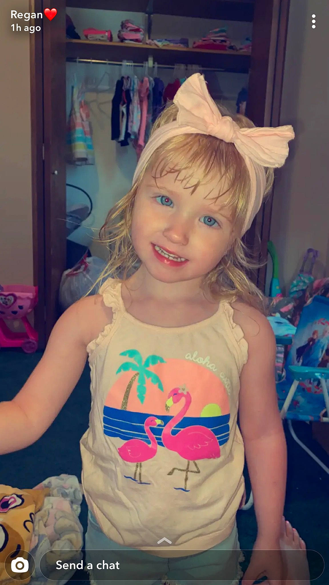 Hazleigh is registered to the contest to win money with this photo: arm, beauty, blue, cheek, child, cool, electric_blue, eye, eyelash, hairstyle, happy, iris, joy, long_hair, mouth, person, pink, sleeve, smile, t_shirt