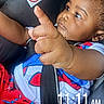 baby, child, car_seat, spiderman_pajamas, hand, finger, blanket, pacifier, clothing, straps, seatbelt, time_stamp, indoor, cute, portrait, infant, expression, looking, closeup, safety