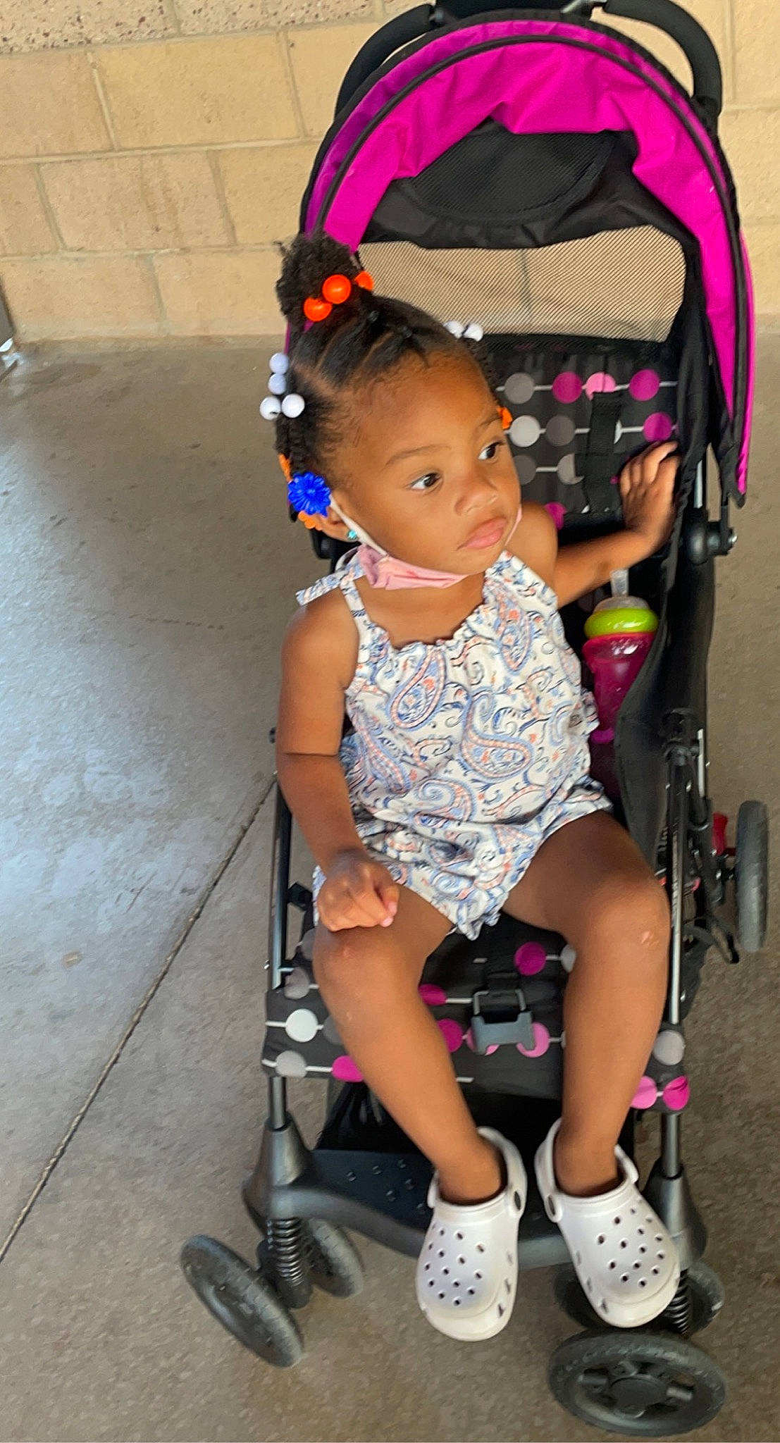Bre'Lynn joined the competition — help win amazing prizes! baby, baby_products, baby_toddler_clothing, chair, child, fashion_accessory, fun, human_leg, magenta, person, photograph, pink, sandal, sitting, snapshot, sock, thigh, tire, toddler, wheel