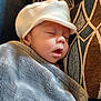 baby, sleeping, hat, blanket, cushion, face, child, cozy, indoors, rest, peaceful, soft_texture, portrait, closeup, cute, comfort, headwear, nap, infant, warm