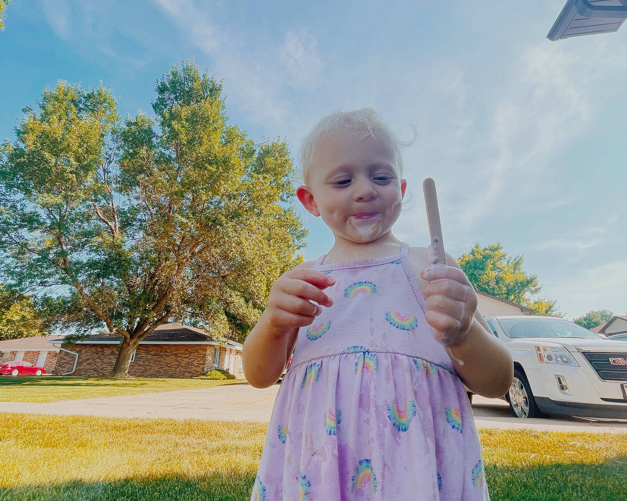 Eden is registered to the contest to win money with this photo: car, cloud, daytime, dress, electric_blue, fun, grass, happy, leisure, people_in_nature, person, plant, recreation, sky, smile, summer, t_shirt, toddler, tree, vehicle_door