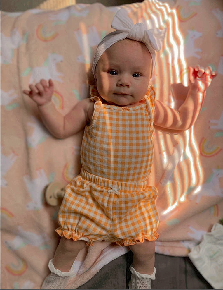 Alina joined the competition — help win amazing prizes! baby, baby_products, baby_toddler_clothing, child, day_dress, doll, fashion_accessory, linens, pattern, peach, person, pink, plaid, room, sitting, sleeve, tartan, toddler, toy, vintage_clothing
