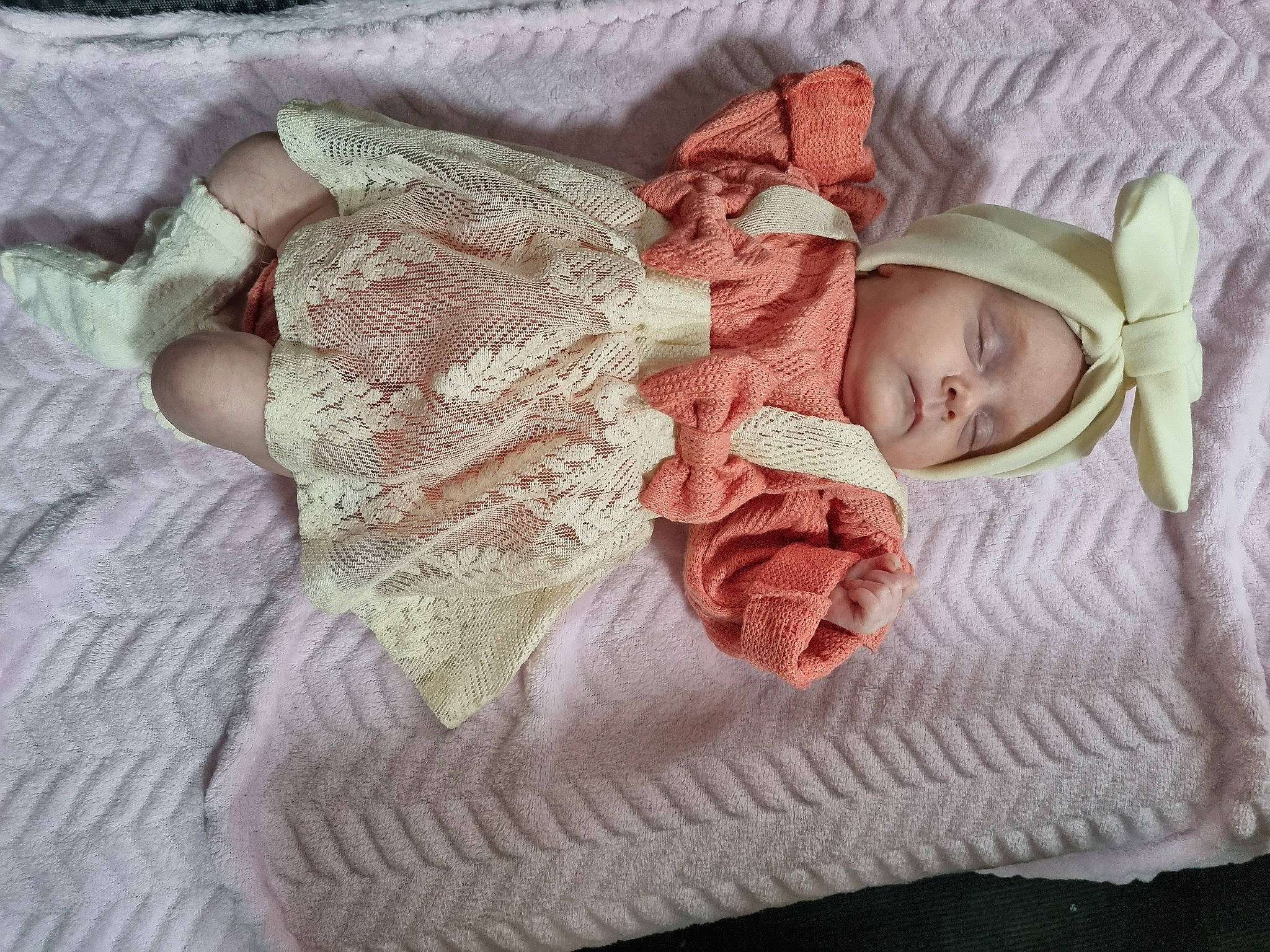 Dottie is registered to the contest to win money with this photo: arm, baby, baby_products, baby_sleeping, baby_toddler_clothing, bedding, child, comfort, fashion_accessory, hand, headgear, headwear, knit_cap, linens, pattern, person, pink, skin, sleeve, textile