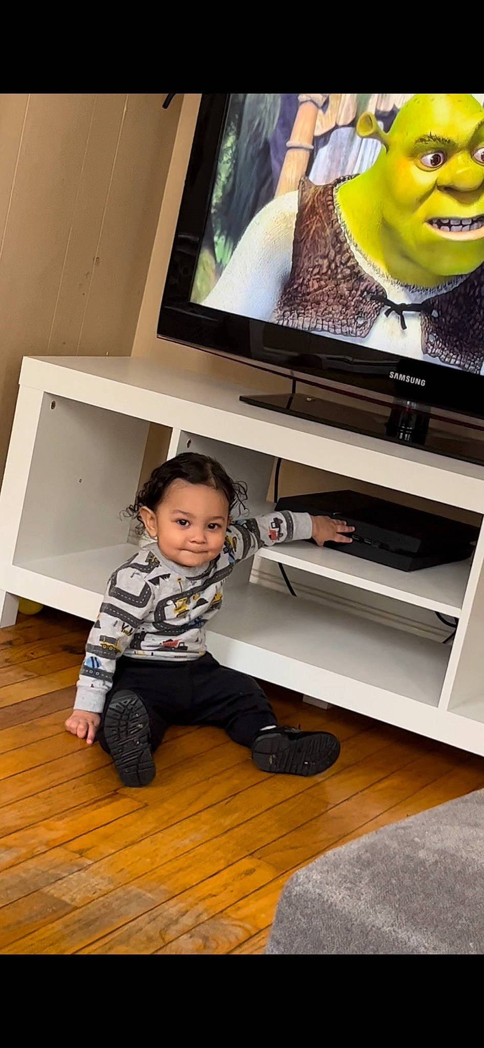 Leonel joined the competition — help win amazing prizes! art, baby_toddler_clothing, clothing, comfort, computer_monitor, entertainment, entertainment_center, flat_panel_display, flooring, fun, hardwood, home_appliance, joy, output_device, person, shelf, smile, t_shirt, television, television_set