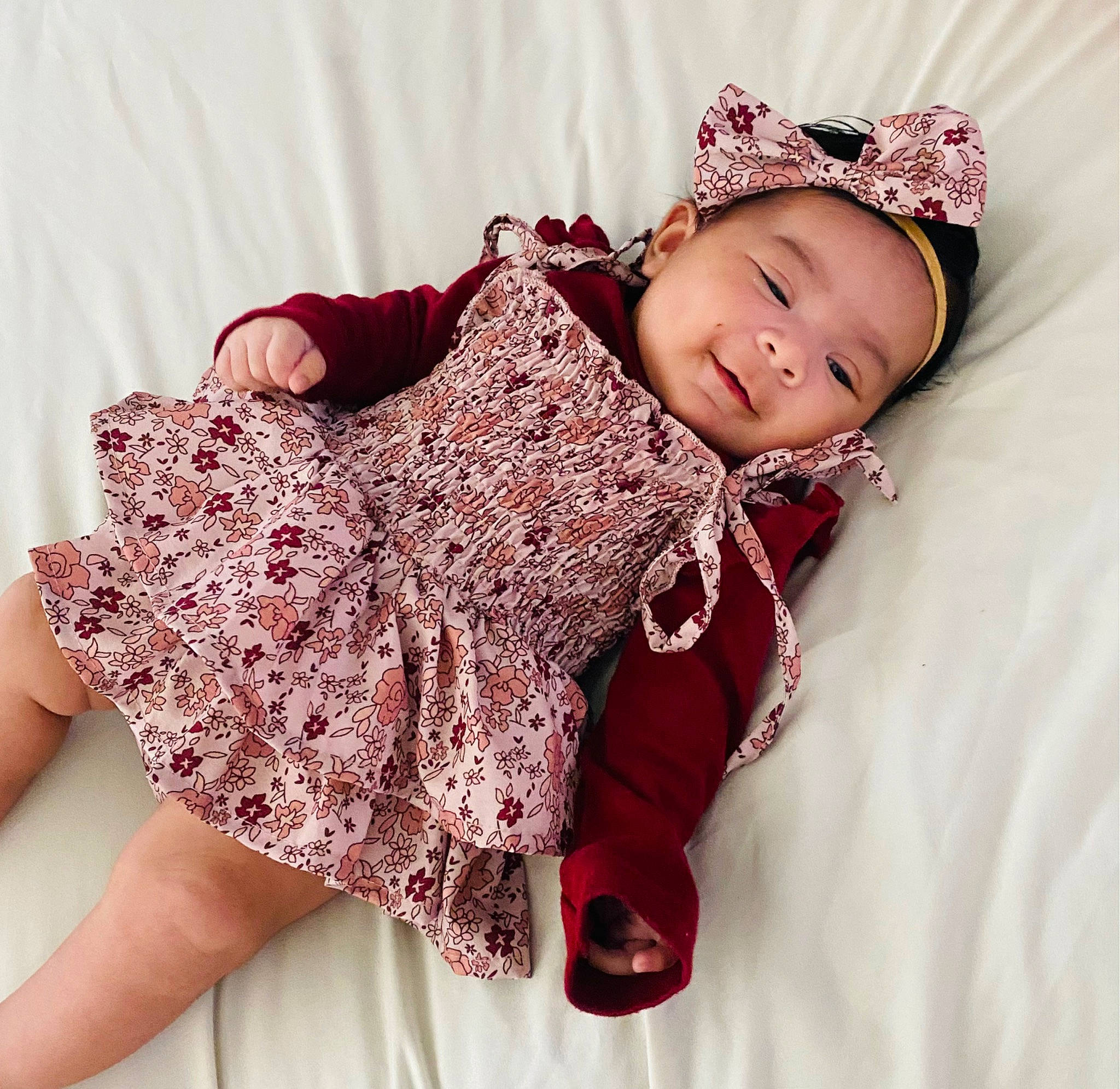 Miley is registered to the contest to win money with this photo: arm, baby, baby_toddler_clothing, clothing, collar, hand, headgear, headwear, magenta, outerwear, pattern, person, pink, purple, red, sleeve, smile, textile, thigh, toddler