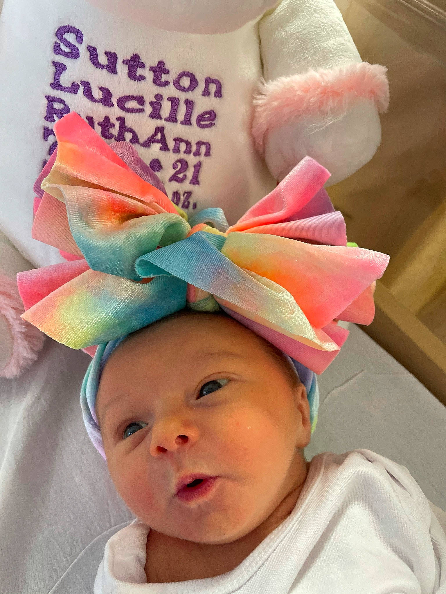 Sutton is registered to the contest to win money with this photo: baby, baby_toddler_clothing, beauty, cap, costume_hat, event, eyelash, fashion_accessory, green, happy, hat, headpiece, headwear, party_supply, person, pink, product, snapshot, textile, toddler