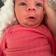 Aria joined the competition — help win amazing prizes! baby, infant, closeup, face, pink_clothing, hand, blanket, expression, newborn, skin, person, portrait, indoors, cute, child, young, apparel, support, head, wide_eyes