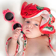 Mila participe au concours pour gagner de l'argent avec cette photo : baby, child, infant, sunglasses, pink, hat, flower_shaped, colorful, white_background, soft_lighting, portrait, cute, hand, face, blue_eyes, summer, accessory, fashion, closeup, skin