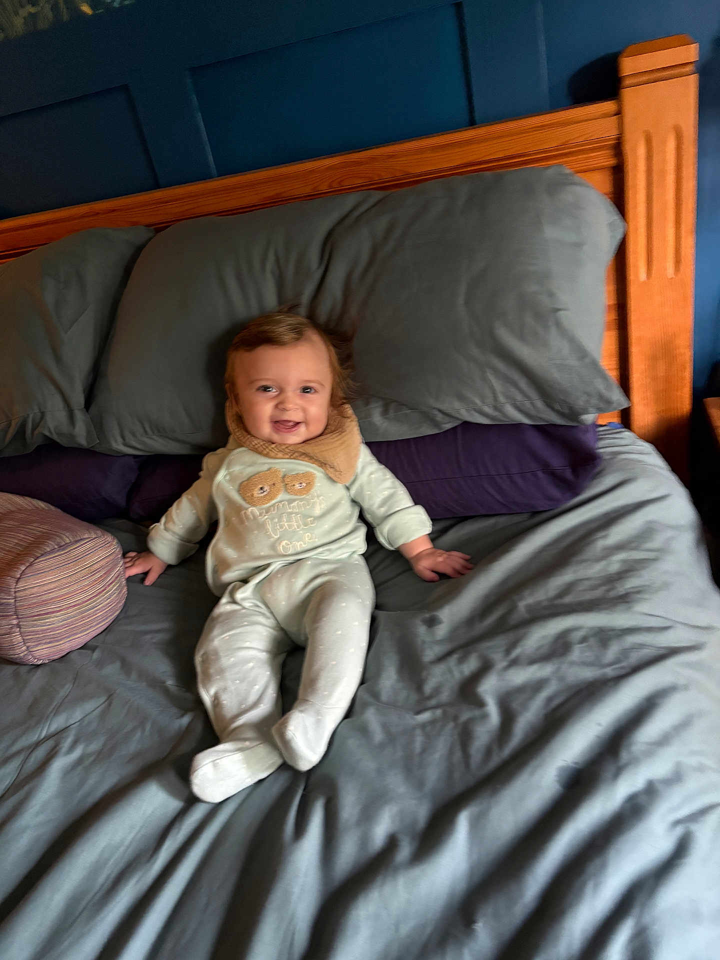 Roman is registered to the contest to win money with this photo: baby, bed, pajamas, smile, happy, child, pillow, blanket, wood, headboard, indoors, person, sleepwear, comfort, rest, furniture, cute, infant, cozy, relaxation