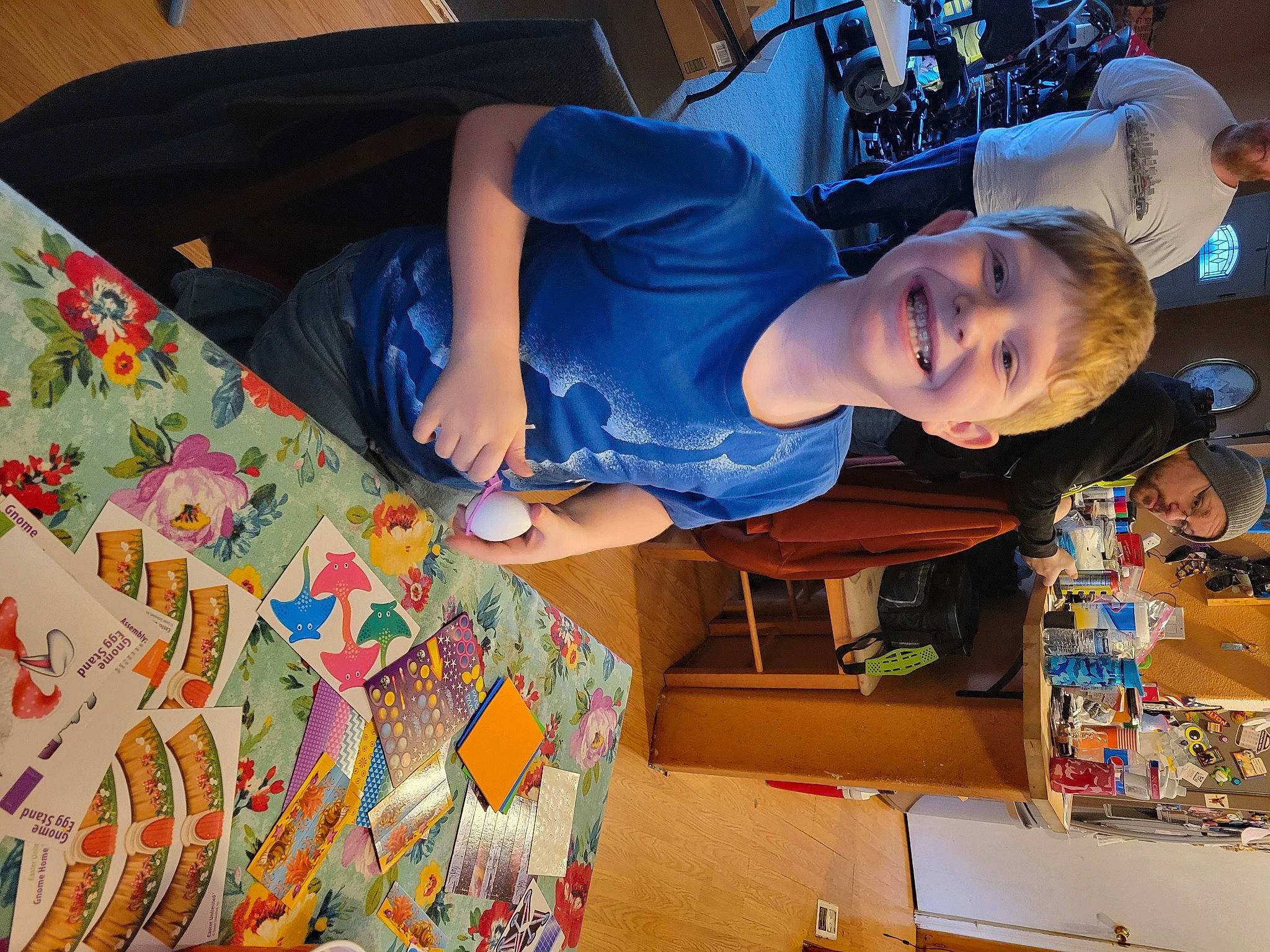 Colton Turner is registered to the contest to win money with this photo: art, artist, box, child, craft, electric_blue, fun, happy, hat, headwear, joy, leisure, linens, pattern, person, room, smile, t_shirt, textile, tree