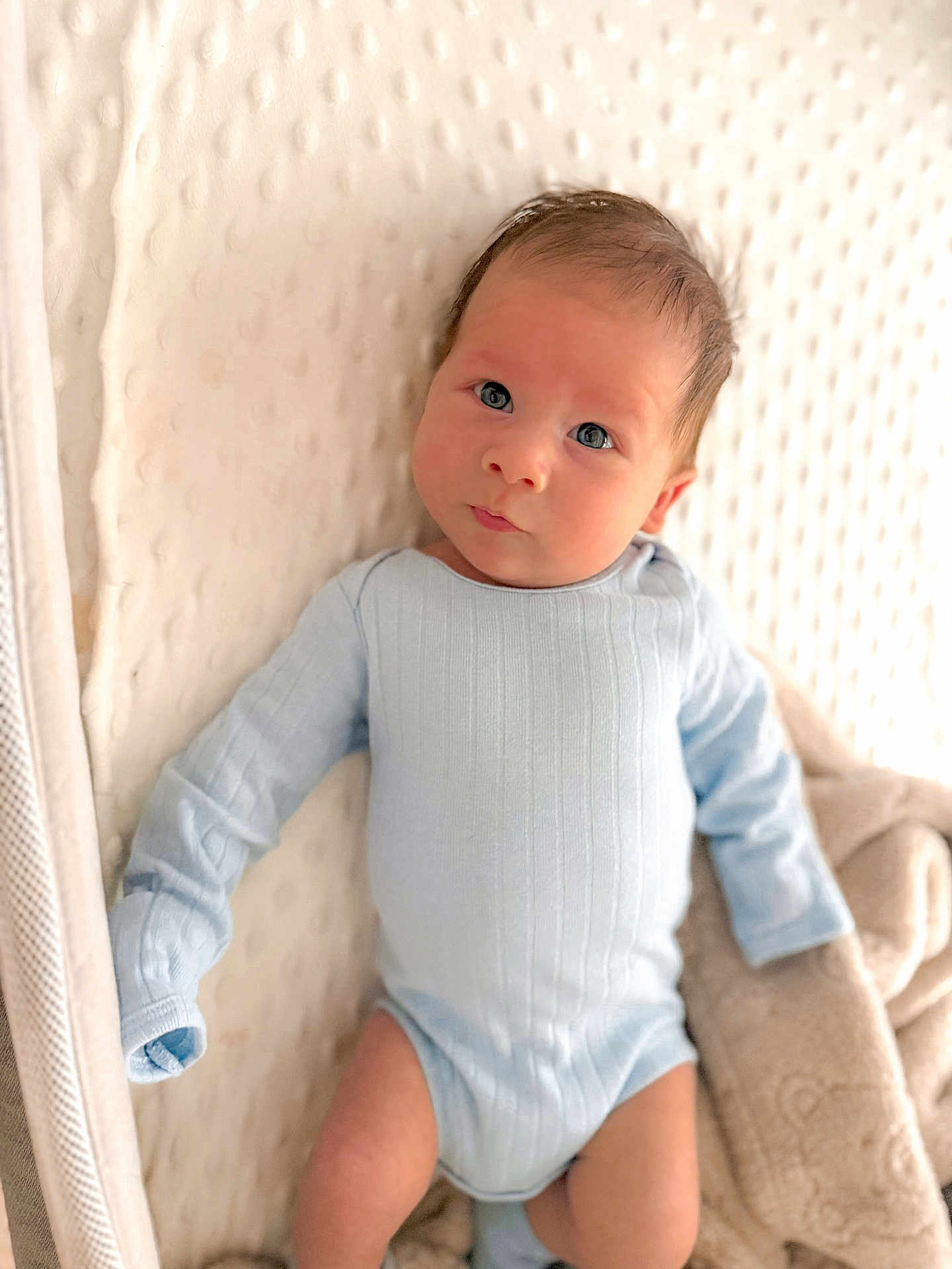 Jennings joined the competition — help win amazing prizes! baby, infant, onesie, blue_clothing, blanket, soft_texture, face, skin, cute, newborn, lying_down, indoors, portrait, baby_bed, curious, head, eyes, small_hands, cozy, resting