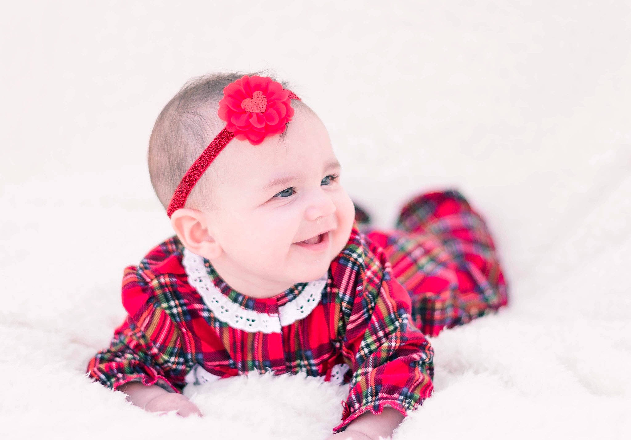 Alina is registered to the contest to win money with this photo: baby, baby_toddler_clothing, cheek, child, clothing, costume_accessory, facial_expression, happy, headgear, headwear, joy, lip, mouth, pattern, person, pink, plaid, red, sleeve, tartan