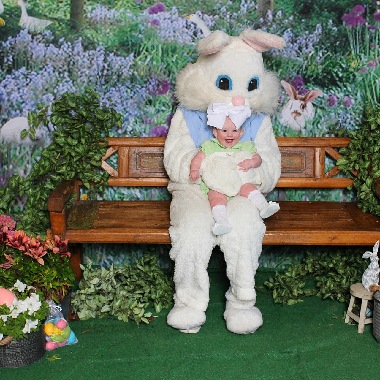 Adaline is registered to the contest to win money with this photo: baby, bench, face, flower, flowerarrangement, flowerbouquet, furniture, garden, geranium, head, jar, nature, outdoors, person, plant, planter, pottedplant, pottery, toy, vase