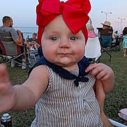 Anara joined the competition — help win amazing prizes! arm, baby, casual, child, crowd, cute, daylight, festival, grass, hand, headwear, infant, outdoor, people, portrait, reaching, red_bow, striped_clothing, summer, tattoo