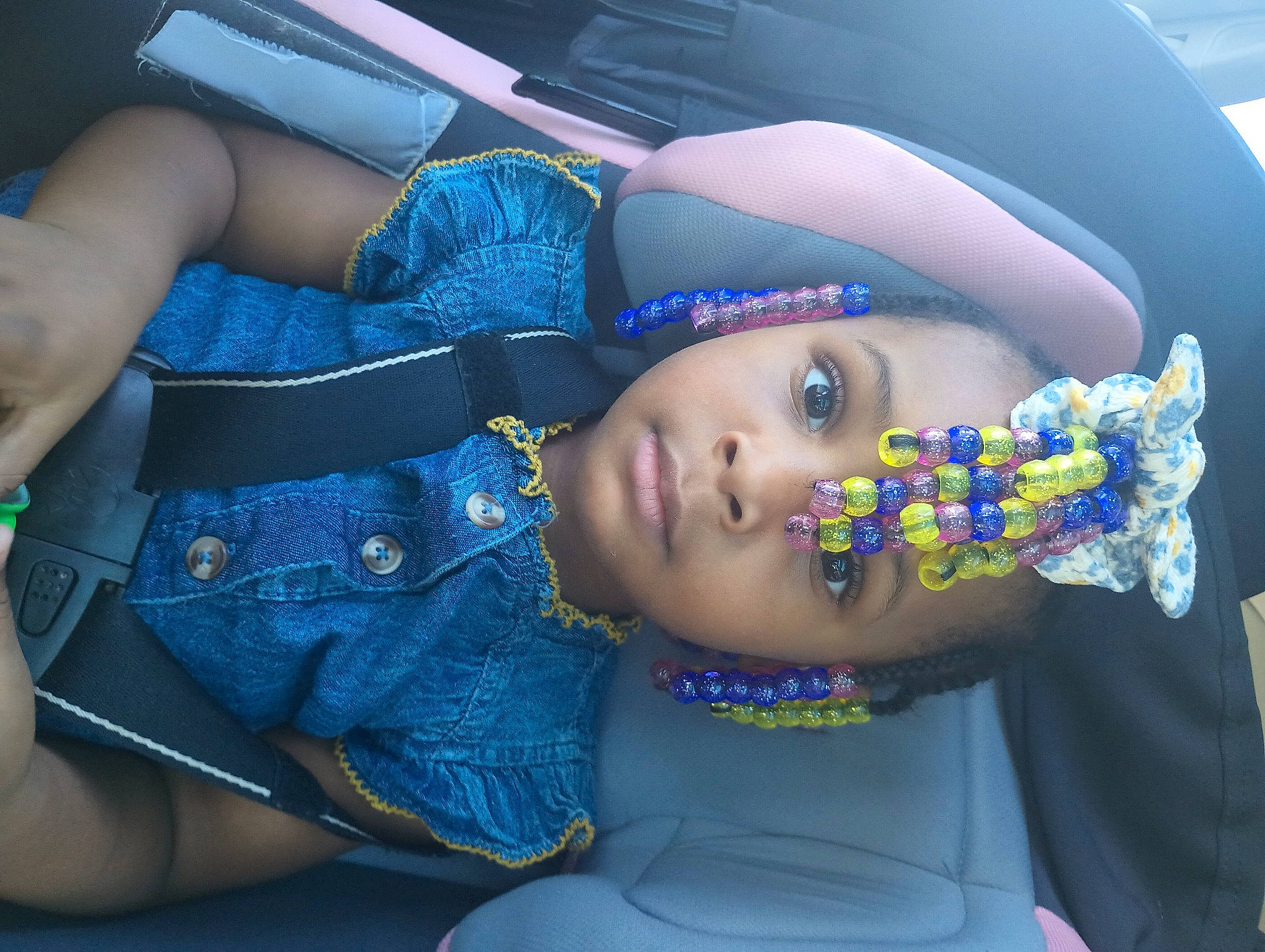 Blessyn is registered to the contest to win money with this photo: auto_part, automotive_design, car_seat, chest, child, electric_blue, family_car, fashion_accessory, flash_photography, fun, happy, luxury_vehicle, nail, pattern, person, purple, sitting, skin, textile, toddler