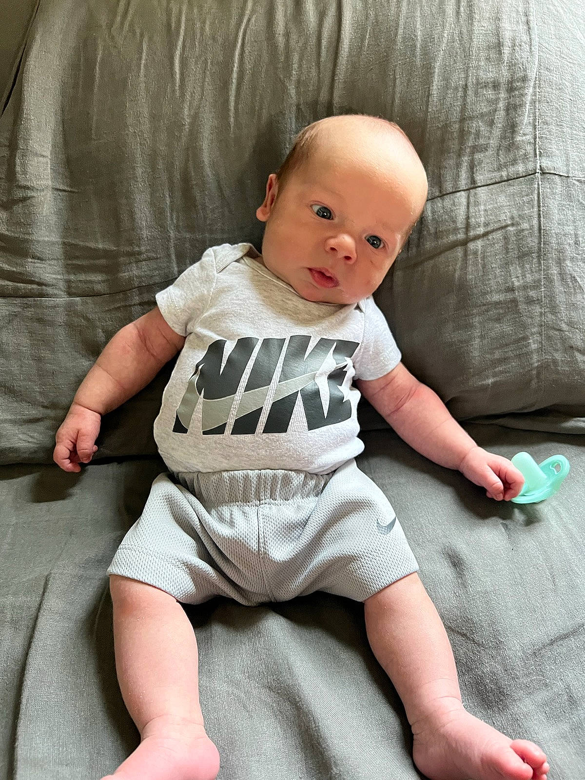 Knox joined the competition — help win amazing prizes! baby, baby_toddler_clothing, barefoot, cheek, child, comfort, eye, foot, human_leg, knee, linens, pattern, person, product, sitting, skin, sleeve, smile, t_shirt, thigh