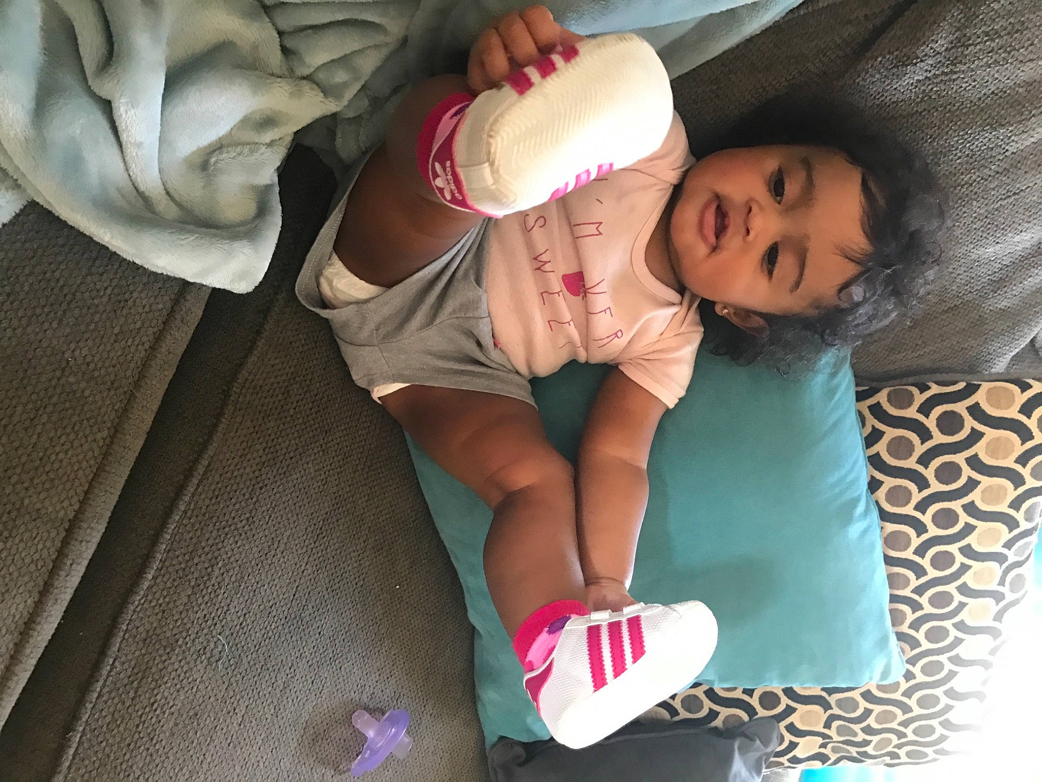 Jaida joined the competition — help win amazing prizes! baby, baby_toddler_clothing, child, comfort, finger, foot, gesture, happy, hat, human_leg, knee, lap, leg, linens, nail, person, sleeve, sock, thigh, toddler