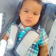 Zayden joined the competition — help win amazing prizes! baby, child, plaid_shirt, stroller, car_seat, safety_harness, sunlight, outdoor, young_child, cute, face, portrait, infant, casual_clothing, seatbelt, baby_boy, people, expression, daylight, closeup