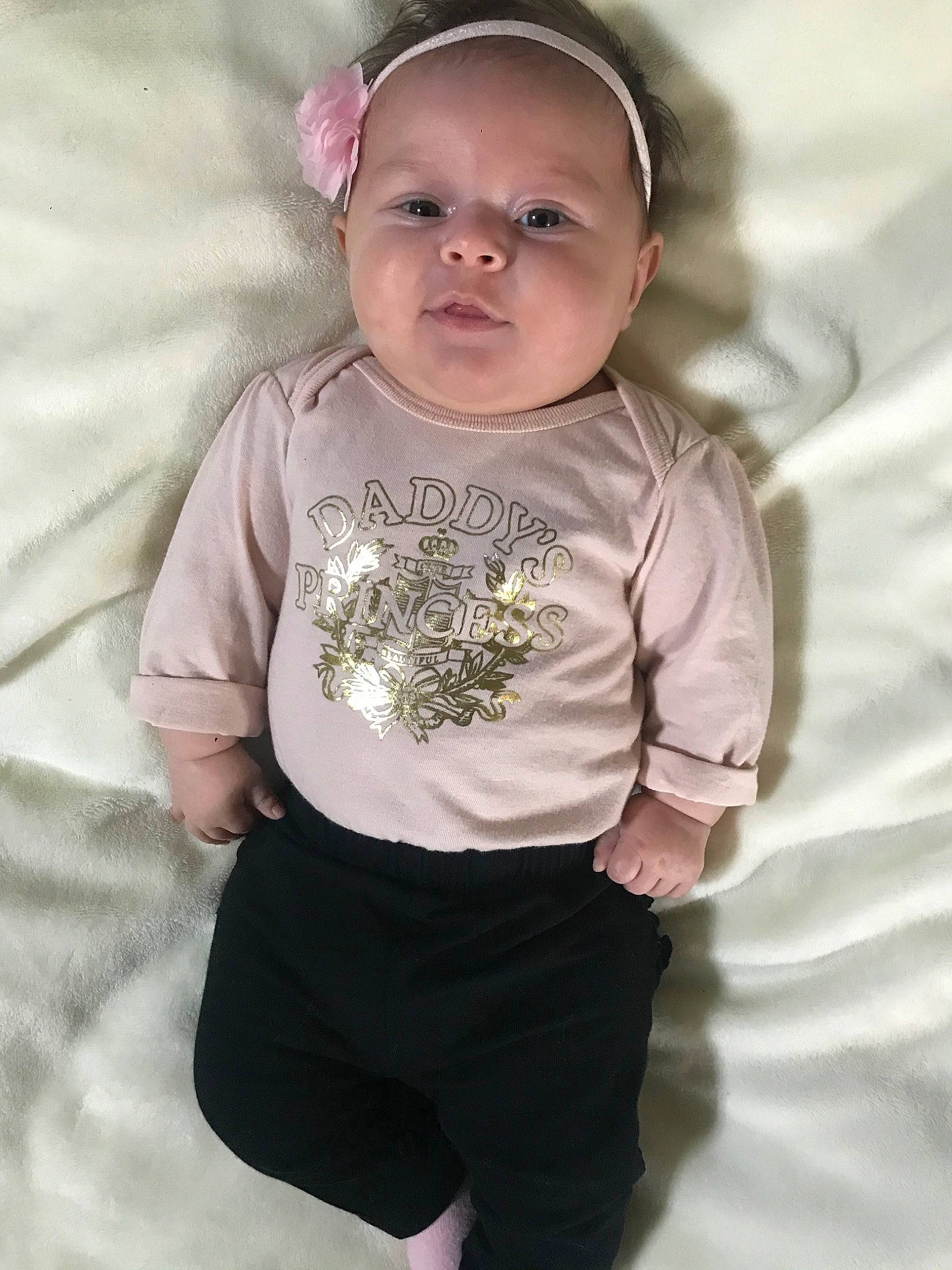 Aliana is registered to the contest to win money with this photo: baby, baby_products, baby_toddler_clothing, child, head, headgear, headwear, person, photography, pink, product, skin, sleeve, smile, t_shirt, toddler, white