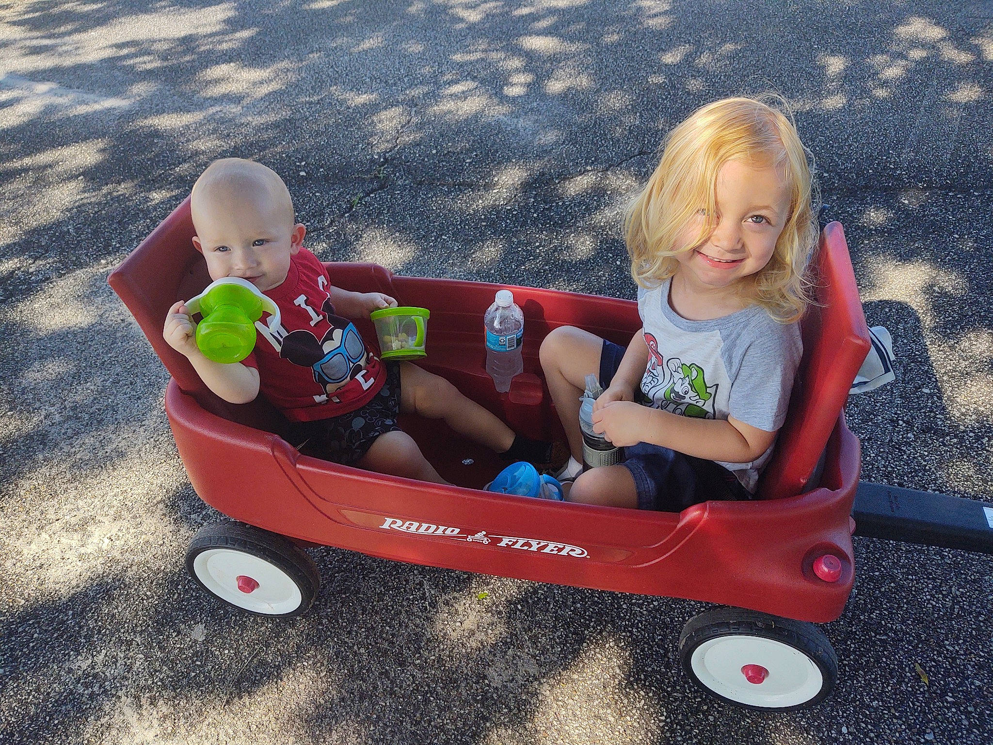 Landon joined the competition — help win amazing prizes! baby, baby_products, child, fun, grass, joy, person, plant, play, product, recreation, riding_toy, sibling, summer, toddler, toy, vacation, vehicle, wagon, wheelbarrow
