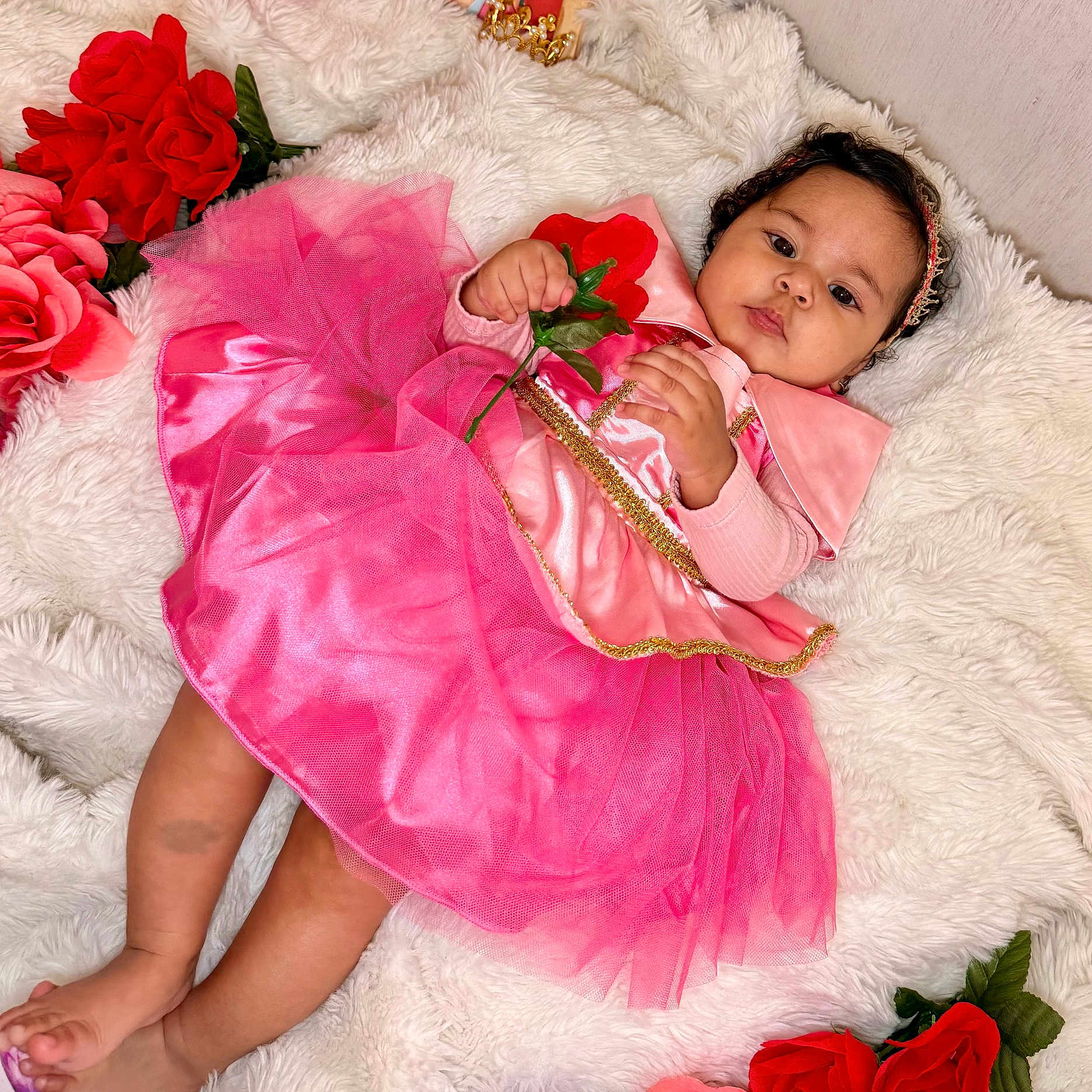 Evangelinne joined the competition — help win amazing prizes! adorable, baby, celebration, child, colorful, cute, decorative_flowers, flower, fluffy_blanket, happy, headband, indoor, infant, lying_down, pink_dress, portrait, red_rose, soft_texture, tutu, young
