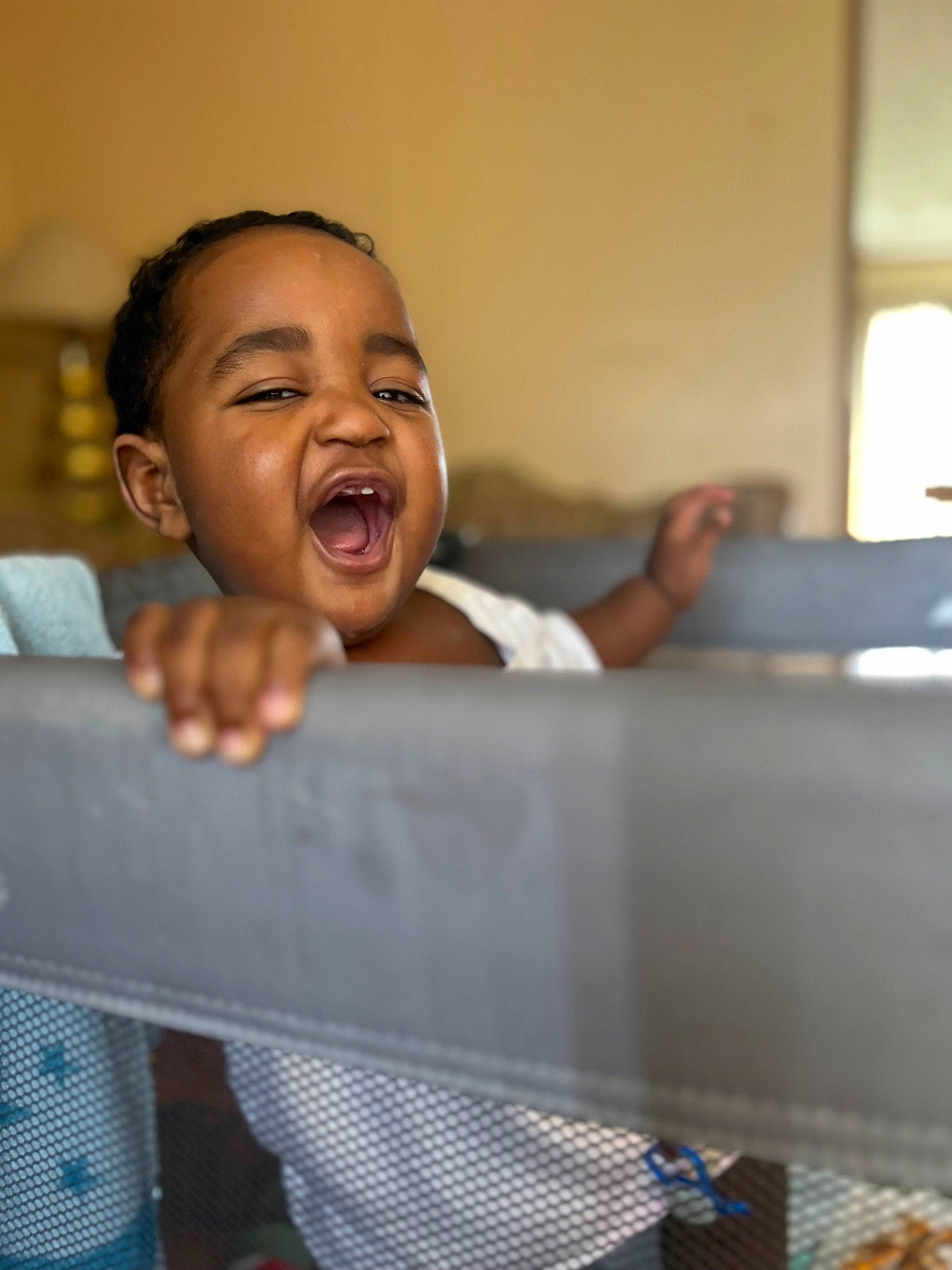 Kobe is registered to the contest to win money with this photo: bathing, black_hair, child, comfort, fun, gesture, happy, jaw, laugh, leisure, lip, nose, person, play, room, shout, sitting, smile, thumb, toddler