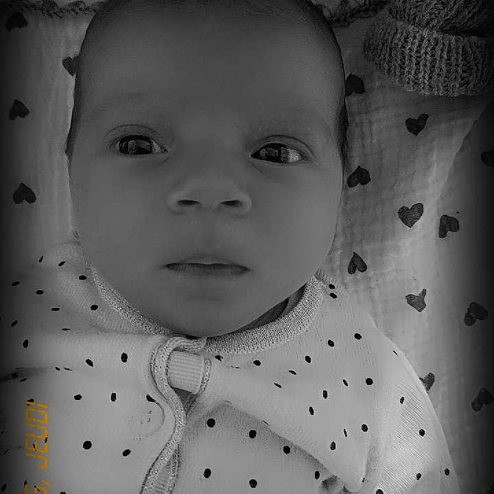 Oria participe au concours pour gagner de l'argent avec cette photo : baby, bedding, black_and_white, blanket, close_up, clothing, cute, eyes, face, gaze, heart_pattern, infant, knit_hat, lying_down, newborn, onesie, polka_dot_clothing, portrait, skin, timestamp