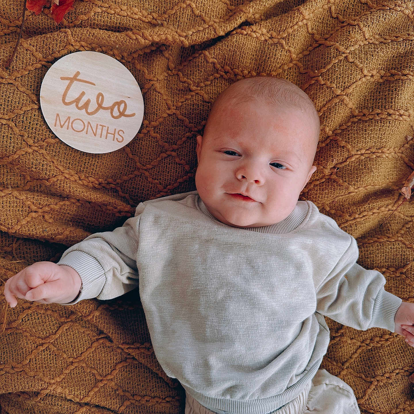 Colter is registered to the contest to win money with this photo: baby, blanket, bodypart, clothing, couch, cushion, face, finger, furniture, hand, head, homedecor, linen, newborn, pants, person, photography, portrait, quilt, t_shirt