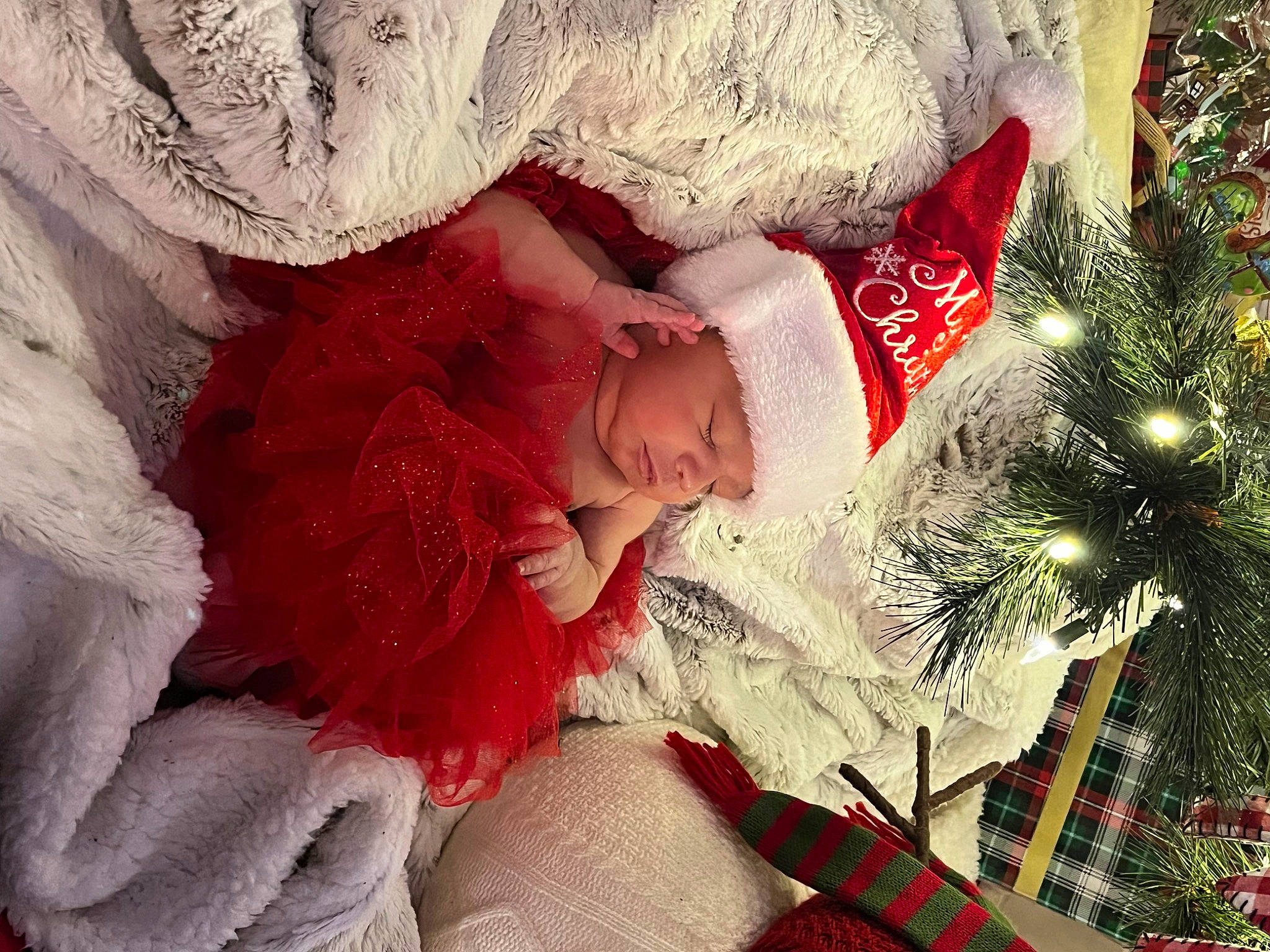 Khamila joined the competition — help win amazing prizes! baby, christmas, christmas_decoration, christmas_eve, christmas_ornament, christmas_tree, conifer, dress, event, fictional_character, fur, happy, headpiece, headwear, holiday, holiday_ornament, ornament, person, petal, santa_claus