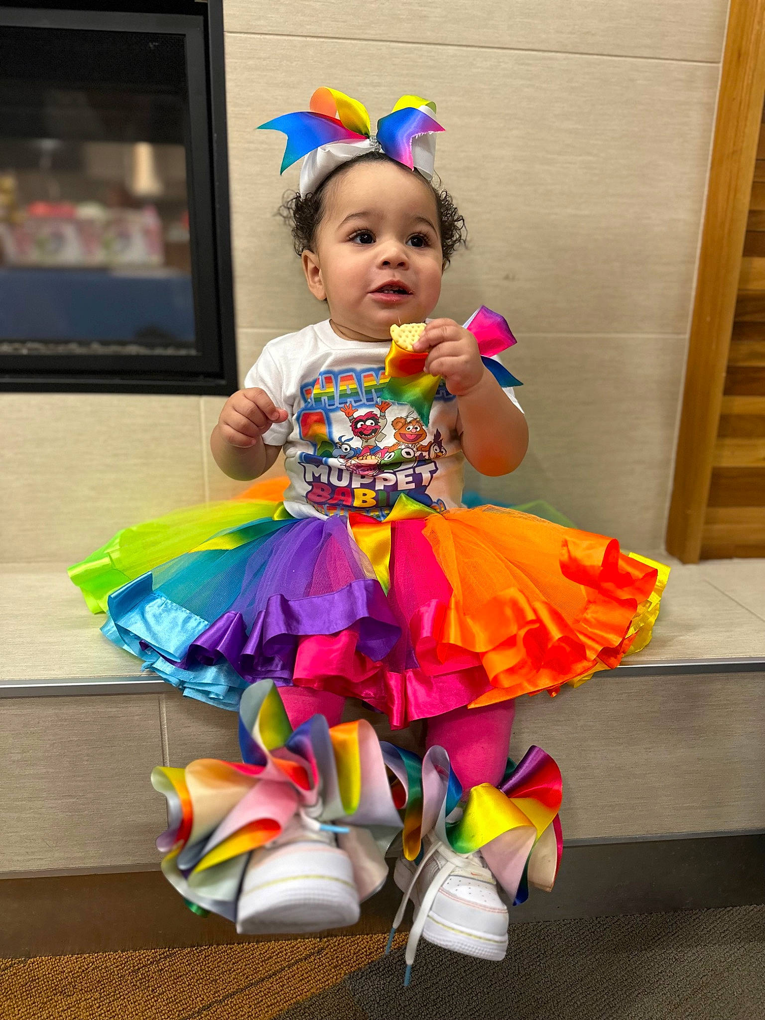Khamila Romero joined the competition — help win amazing prizes! baby, baby_products, baby_toddler_clothing, child, costume, dress, entertainment, event, fun, happy, leisure, magenta, party_supply, person, pink, purple, recreation, room, sitting, television