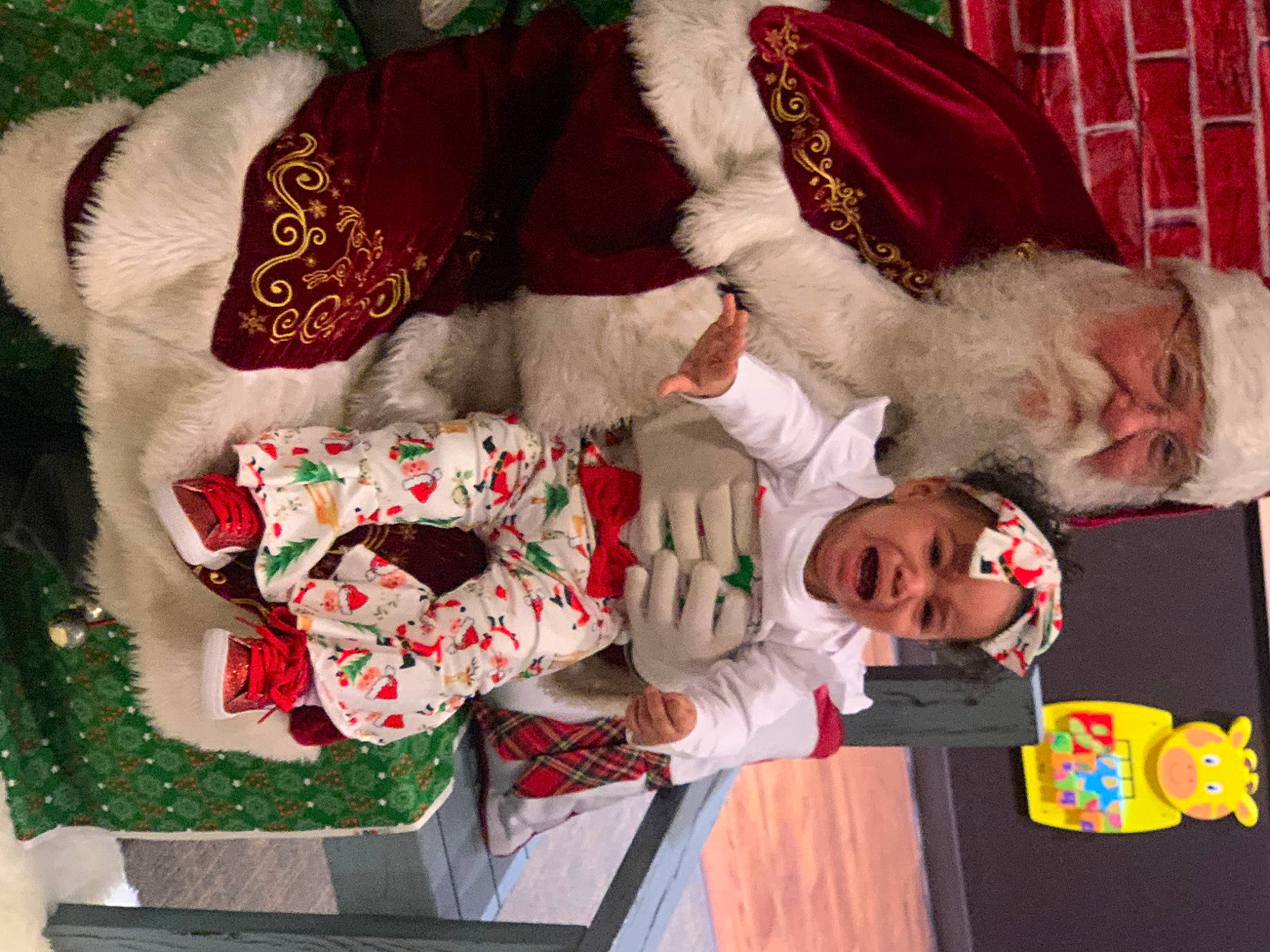 Khamila Romero joined the competition — help win amazing prizes! carmine, child, christmas, christmas_decoration, christmas_eve, christmas_ornament, event, fictional_character, fur, headwear, holiday, holiday_ornament, lap, mammal, person, red, room, santa_claus, smile, sorrow