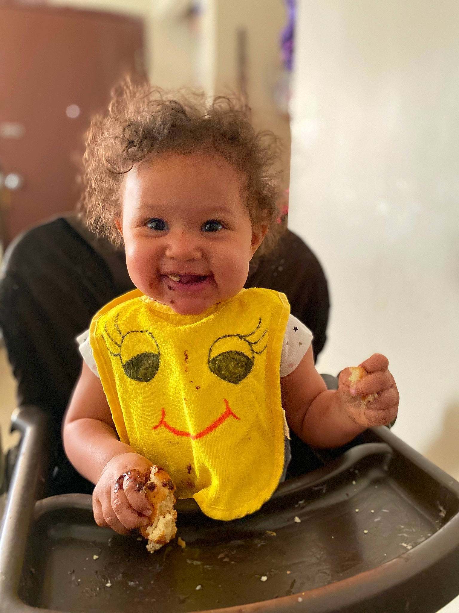 Izzabella is registered to the contest to win money with this photo: baby, baby_products, baby_toddler_clothing, bathing, cheek, child, finger, fun, hand, happy, joy, person, photograph, play, recreation, sitting, skin, sleeve, smile, t_shirt