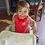 Andrès a rejoint le concours — aidez-le/la à gagner de superbes lots ! toddler, child, high_chair, messy, chocolate, face, hands, red_shirt, indoor, kitchen, table, chair, floor, smile, food, mess, baby, sitting, cute, playful