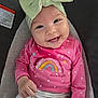 Evelyn joined the competition — help win amazing prizes! baby, child, smiling, headband, pink_shirt, rainbow, polka_dot, white_pants, cushion, sitting, face, happy, indoors, clothing, person, infant, cute, closeup, portrait, warning_label
