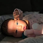 Evelyn joined the competition — help win amazing prizes! baby, infant, face, eyes, hand, plush_toy, pacifier, lying_down, soft_lighting, close_up, cute, cozy, sleepwear, newborn, child, portrait, expression, indoors, skin, person