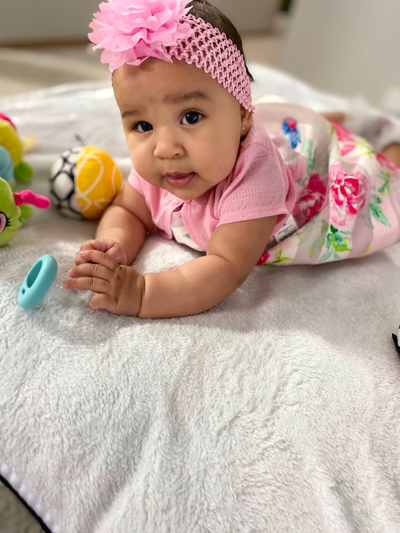 Ivy is registered to the contest to win money with this photo: baby, baby_toddler_clothing, cap, child, comfort, dress, face, facial_expression, fun, happy, headgear, headpiece, headwear, magenta, person, pink, skin, sleeve, smile, textile