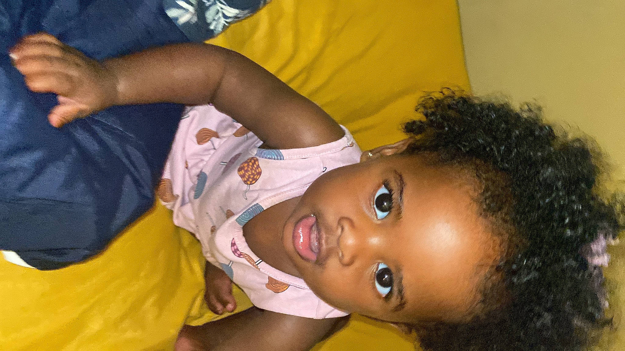 Deja is registered to the contest to win money with this photo: afro, cheek, child, eye, eyelash, face, fun, gesture, happy, jheri_curl, leisure, nose, person, plant, t_shirt, toddler