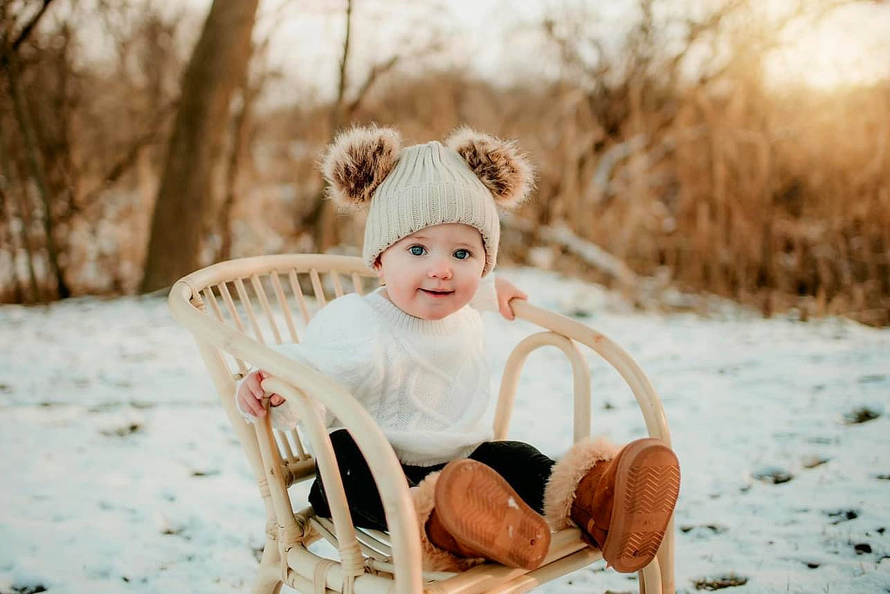 Analeia joined the competition — help win amazing prizes! baby, baby_toddler_clothing, chair, dress, face, fashion_accessory, flash_photography, fun, grass, happy, hat, headpiece, headwear, joy, person, plant, sitting, smile, snow, toddler