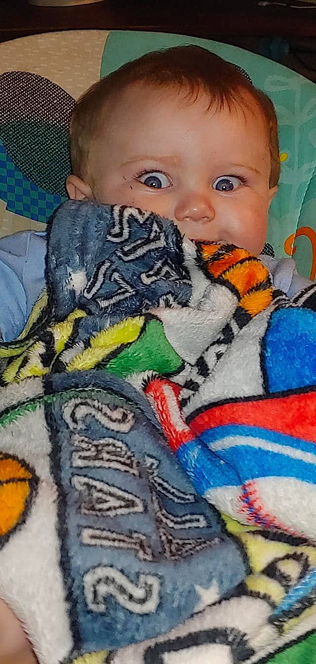 Hayden is registered to the contest to win money with this photo: art, baby, blanket, cheek, child, eye, face, head, linens, mouth, nose, person, play, quilt, textile, toddler, toy