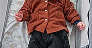 Thanaïs participe au concours pour gagner de l'argent avec cette photo : baby, baby_bed, child, childcare, clothing, corduroy_jacket, cute, cute_outfit, indoor, infant, lying_down, pacifier, pants, person, pink_pacifier, playpen, portrait, socks, soft_bedding, white_socks
