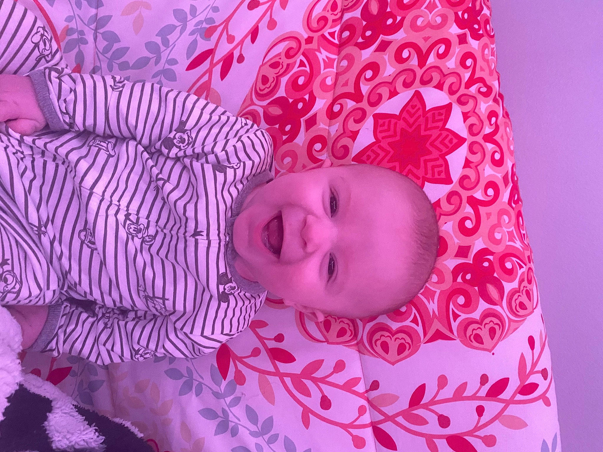 Hayden is registered to the contest to win money with this photo: baby, baby_toddler_clothing, cheek, child, eye, head, linens, lip, magenta, nose, pattern, person, pink, product, purple, skin, sleeve, smile, textile, toddler